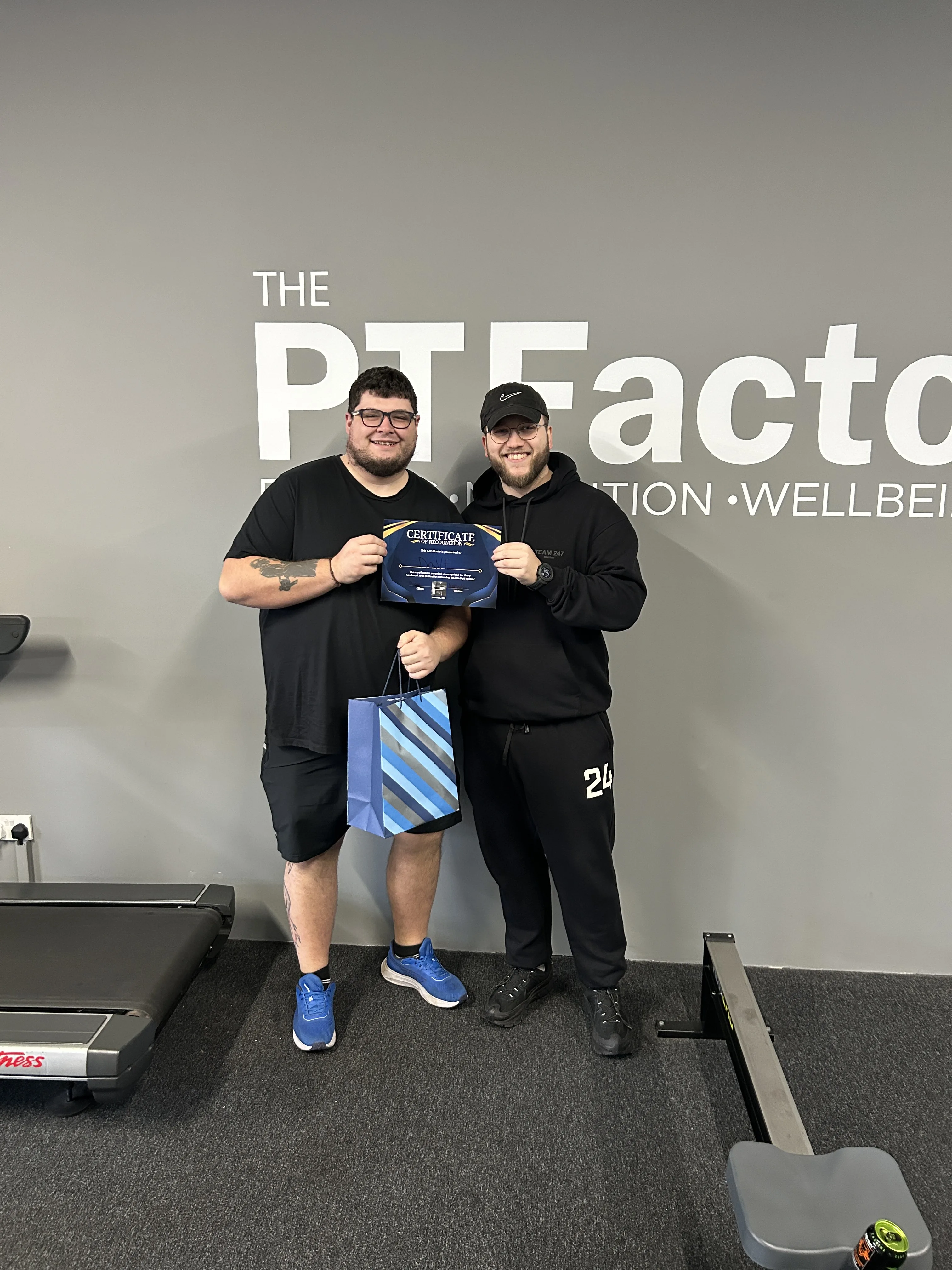 Kallum with Dave celebrating his weight loss achievement at The PT Factory